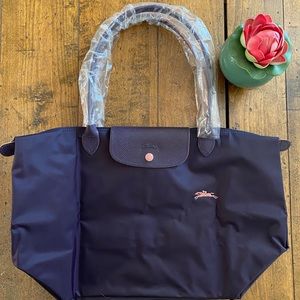 Brand New and Never Used Longchamp Le Pliage pretty plum nylon tote